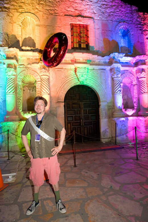 Chuck Ramirez in front of Bill FitzGibbons Alamo lights